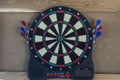 electronic dartboard on wooden background Royalty Free Stock Photo