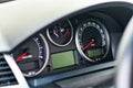 Electronic dashboard of modern luxury car with lcd display and with red arrows speedometer tachometer and other tools and icons