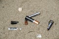 Electronic discarded battery waste on sandy sea coast ecosystem, sea pollution disease