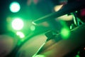 Electronic drums set with cymbals in the green light