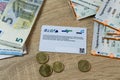 electronic eTicket on table among euro, monthly travel passes in germany for public transport, travel concept for country,