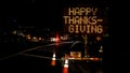 An electronic freeway sign stating Happy Thanksgiving