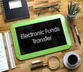 Electronic Funds Transfer on Small Chalkboard. 3D. Royalty Free Stock Photo