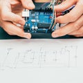 Electronic invention engineer hands circuit design