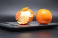 Electronic kitchen scale with two tangerines, calorie counting. Royalty Free Stock Photo