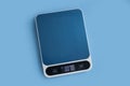 Electronic kitchen scales kitchen  balance   equipment  portable  on a colored background Royalty Free Stock Photo