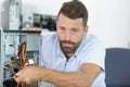 electronic male worker repairs pc Royalty Free Stock Photo