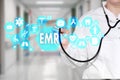 Electronic medical records. EMR on the touch screen with medicine icons on the background blur Doctor in