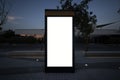 Electronic modern empty scoreboard on the background of a city street in the evening. Blank mock up of vertical street