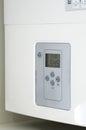 Electronic panel of a white electric water heater. Royalty Free Stock Photo