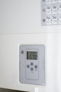 Electronic panel of a white electric water heater. Royalty Free Stock Photo