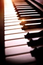 Electronic piano keyboard in the shade with shine elevated view Royalty Free Stock Photo