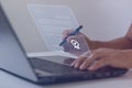 Electronic Signature Concept. Businessman working on a laptop computer and using a pen to sign electronic documents Royalty Free Stock Photo