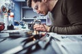 Electronic technician working in the repair shop Royalty Free Stock Photo