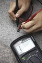 Electronic test and measurement with digital multimeter check for continuity Royalty Free Stock Photo