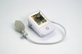 An electronic tonometer, white, for measuring blood pressure. Background for health and medicine