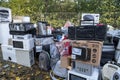 Electronic waste Awaiting recycling. A pile of garbage in nature. Green strategy recycling