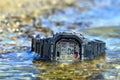 Electronic waterproof watch, immersed in the water stream