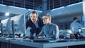 Electronics Development Engineer Uses Personal Computer Talks with Manager, Shows Project. Team of Royalty Free Stock Photo