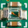 Electronics Failure - Macro of a Blown Fuse on a PCB Royalty Free Stock Photo