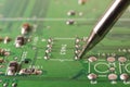 Electronics manufacturing services, soldering of electronic board Royalty Free Stock Photo