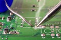 Electronics manufacturing services, soldering of electronic board Royalty Free Stock Photo