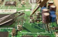 Electronics manufacturing services, soldering of electronic board Royalty Free Stock Photo