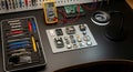 Electronics Repair Workbench with Tools and Components Royalty Free Stock Photo