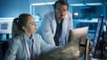 Electronics Research, Development Facility: Engineer Project Manager Consults Scientist working on Royalty Free Stock Photo