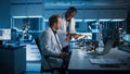 Electronics Research, Development Facility: Engineer Project Manager Consults Scientist Working on Royalty Free Stock Photo