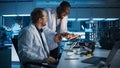Electronics Research, Development Facility: Engineer Project Manager Consults Scientist Working on Royalty Free Stock Photo