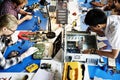 Electronics technicians team working on computer parts Royalty Free Stock Photo