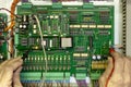 Electronics test engineer testing a digital circuit board