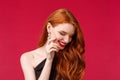 Elegance, beauty and fashion concept. Close-up portrait of coquettish redhead pretty woman blushing, giggle and look Royalty Free Stock Photo