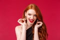 Elegance, beauty and fashion concept. Close-up portrait of sassy good-looking seductive young redhead woman touching her Royalty Free Stock Photo