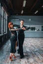 Elegance couple on ballrom dance training in class