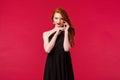 Elegance, fashion and woman concept. Portrait of seductive sensual redhead woman with red lipstick, wear evening stylish