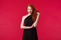 Elegance, fashion and woman concept. Seductive gorgeous redhead woman in black fashionable dress, attend formal event