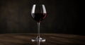 Elegance in a glass - A single red wine on a table Royalty Free Stock Photo