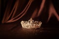 Elegance luxury royal crown on satin, silk background. Queen