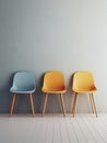 Elegance meets simplicity in this minimalist studio shoot of a beautifully designed room with three colorful chairs.