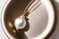 Elegance in Motion The Enchanting Pearl Drop Pendant.AI Generated