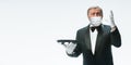 Elegance senior man waiter in protective face mask on white background. Flyer with copyspace.