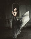 Elegance woman with flying dress in palace room Royalty Free Stock Photo