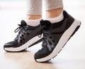 Elegance women`s feet in sneakers