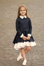 Elegance that you deserve. Little child wear uniform dress outdoors. Back to school fashion. Fashion look of small girl