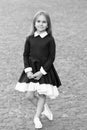 Elegance that you deserve. Little child wear uniform dress outdoors. Back to school fashion. Fashion look of small girl