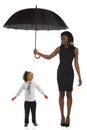 Elegant african woman is standing and holding umbrella above lottle boy. Full length on white background