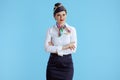 elegant air hostess woman on blue in uniform Royalty Free Stock Photo