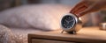The elegant alarm clock on a bedside table in a cozy bedroom setting..AI generated image Royalty Free Stock Photo